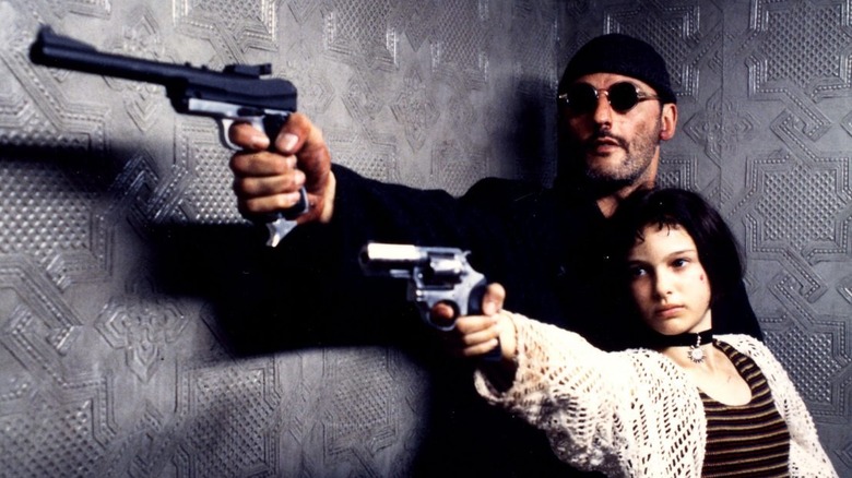 Jean and Natalie point guns
