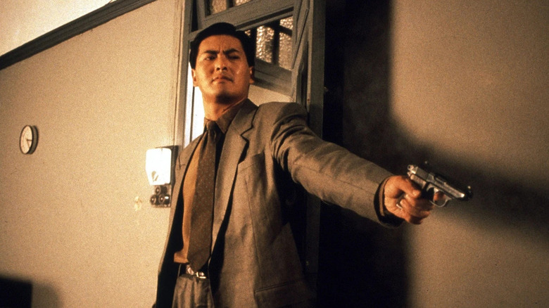 Chow Yun-Fat points gun