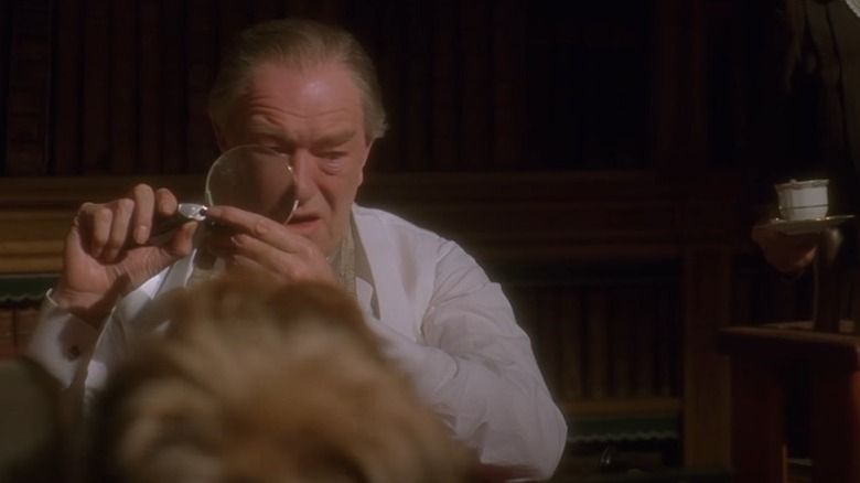 Michael Gabon with magnifying glass.