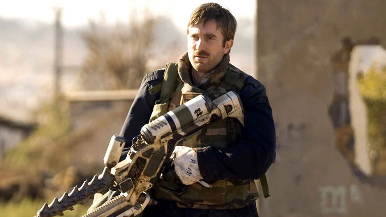 Sharlto Copley with a gun