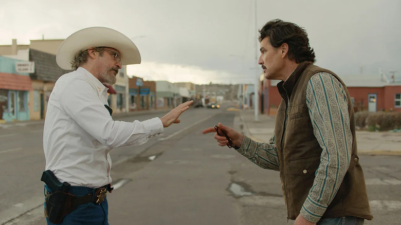 Joe and Ted yelling at each other in town in Eddington