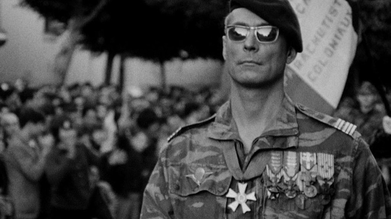 Soldier wearing medals and sunglasses in The Battle of Algiers