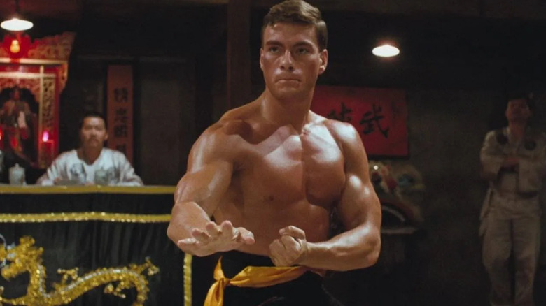 Frank Dux flexes his muscles while preparing to battle in the underground fighting tournament in "Bloodsport"