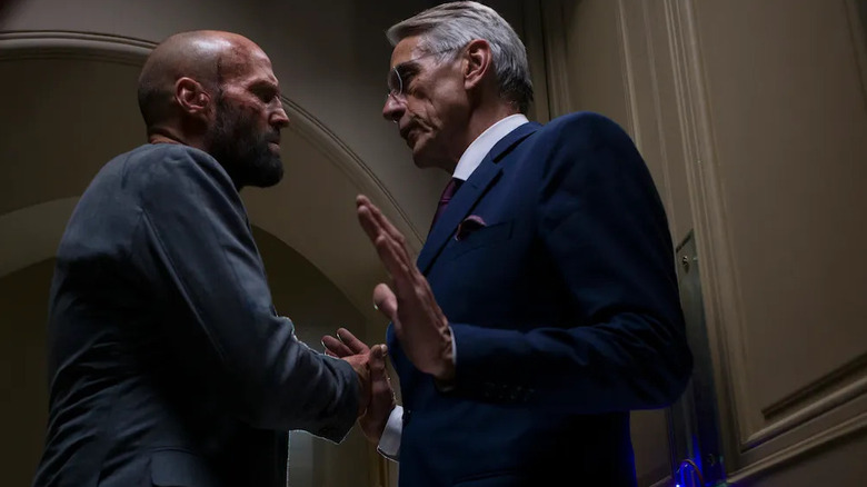 Adam Clay intimidating Wallace Westwyld inside his home while covered in sweat and blood in The Beekeeper