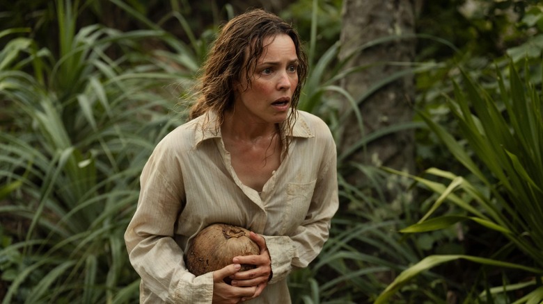 Linda holding a coconut shocked in Send Help