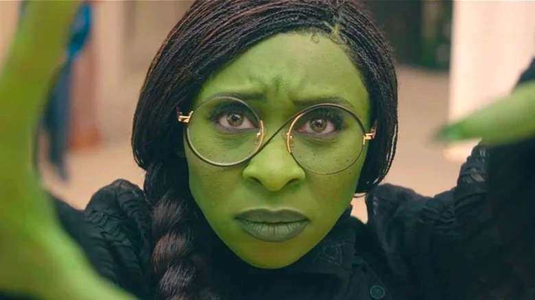 Elphaba stretches out her arms in 