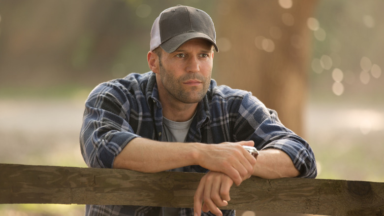 Phil Broker leaning on a wooden fence in Homefront