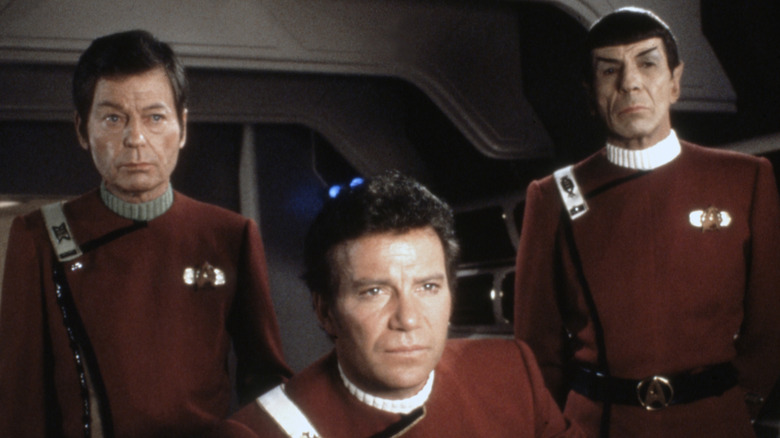 Bones and Spock standing behind Kirk in Star Trek II: The Wrath of Khan (1982)