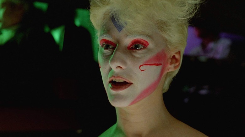 Margaret talking in white, red, and blue face paint in Liquid Sky (1982)