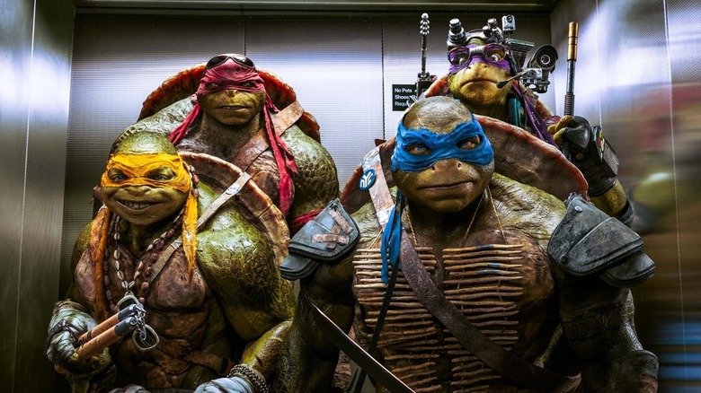The titular heroes of Teenage Mutant Ninja Turtles in an elevator