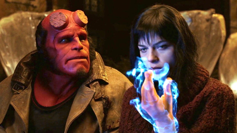 Hellboy watches Liz use her flames
