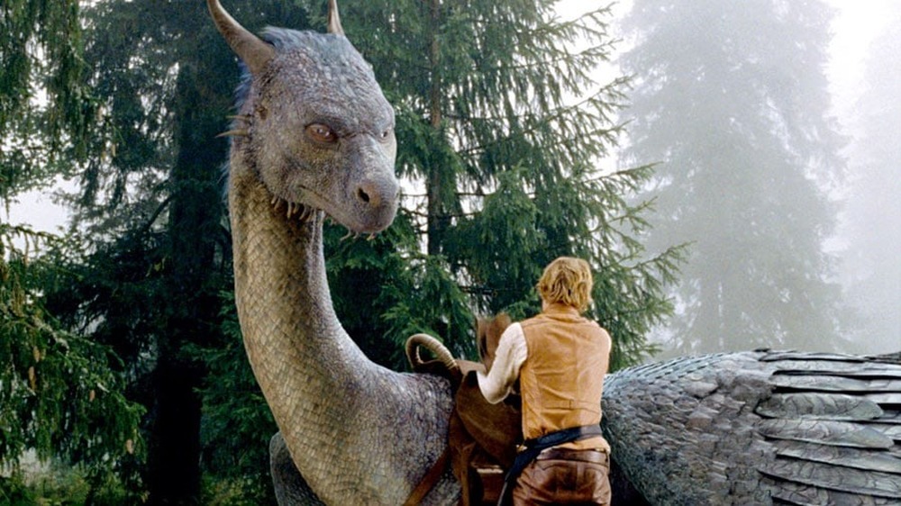 Eragon saddling dragon