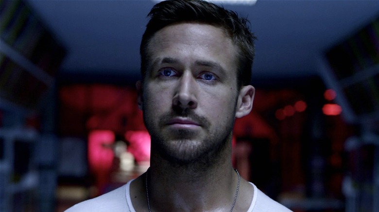 Julian Thompson walking in dark room