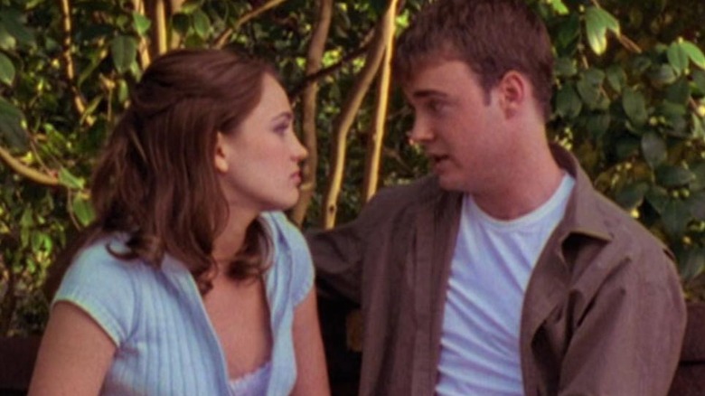 Two teens on a bench