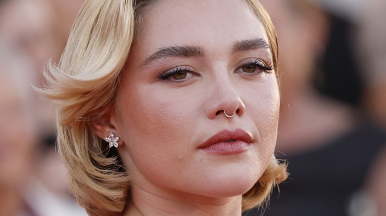 Florence Pugh eyes half closed on red carpet