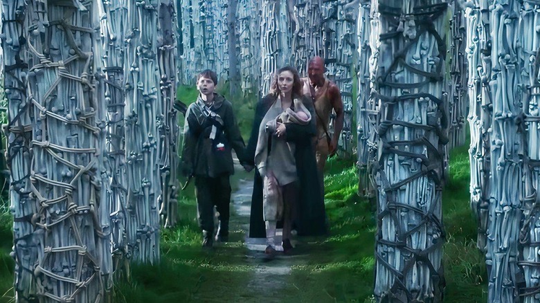 Survivors walk through the bone temple in "28 Years Later" (2025)