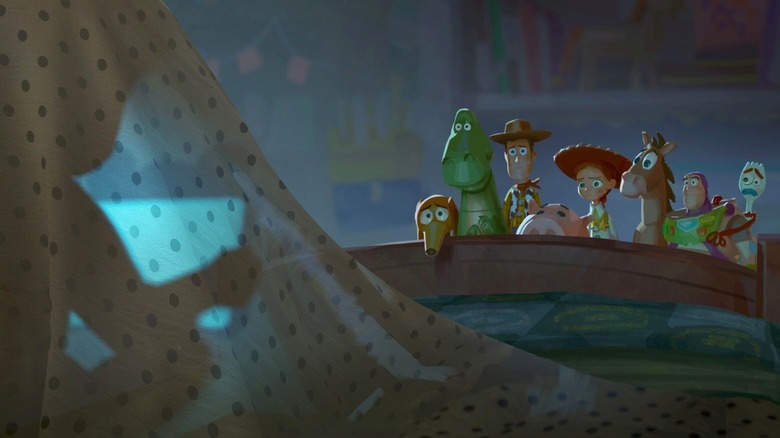 Woody, Buzz, and the gang look at a kid sitting under a sheet in "Toy Story 5" (2026)