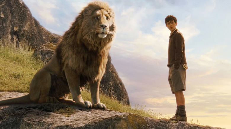 Aslan and Peter standing on a cliff in "The Chronicles of Narnia: The Lion, the Witch, and the Wardrobe" (2005)