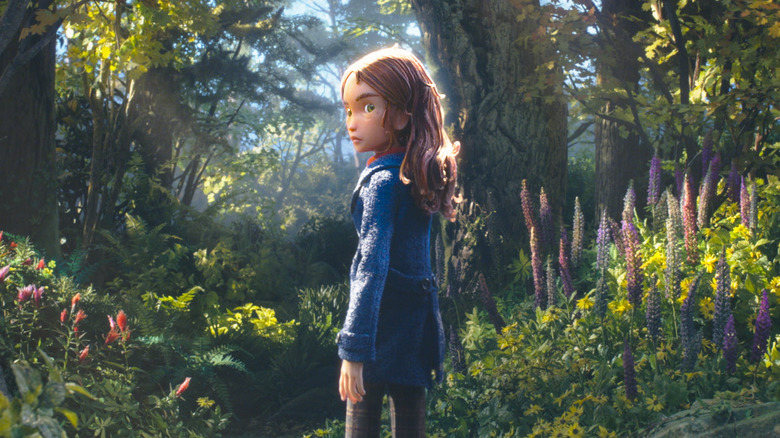 A girl stands in the forest in "Wildwood" (2026)
