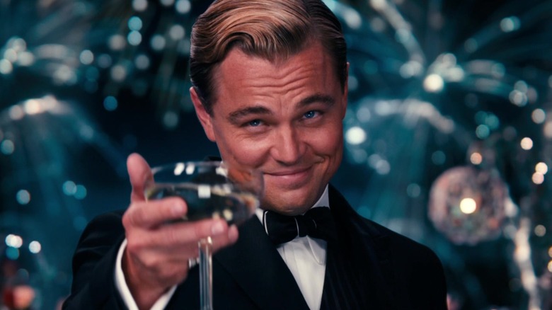 Jay Gatsby toasts with champagne