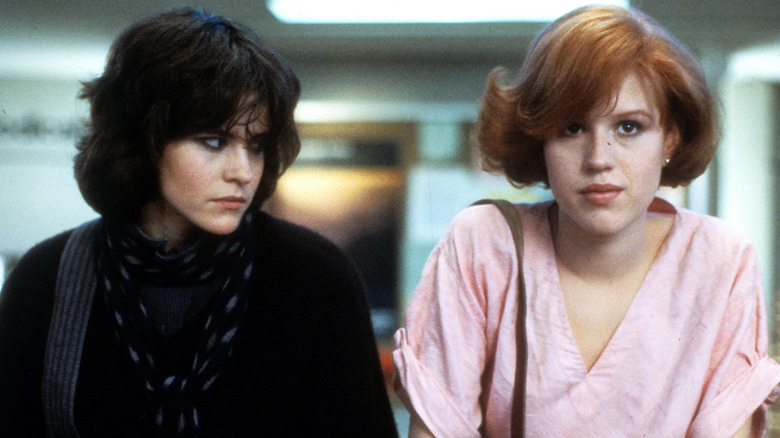 Claire and Allison sitting on table together in The Breakfast Club