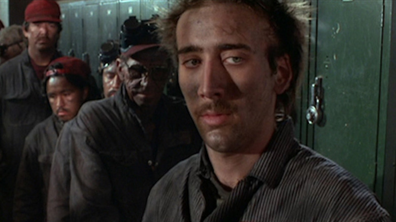 H.I. stands by his locker looking suspiciously off screen in Raising Arizona (1987)