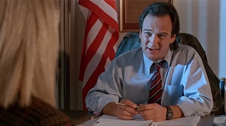 Principal Latimer talks to Sonia in his office in Abraxas: Guardian of the Universe (1991)
