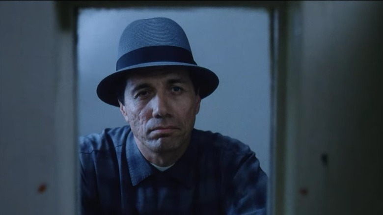 American Me's Montoya Santana looking through glass