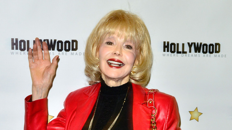 Francine York waving and smiling