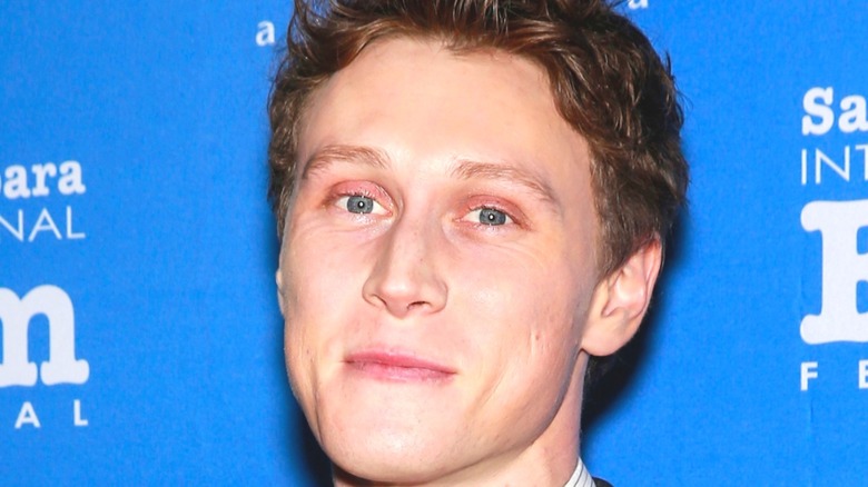 George MacKay smiling