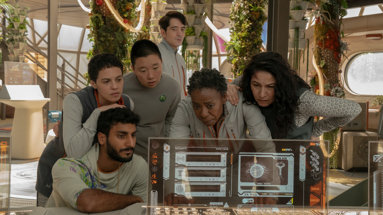 SecUnit's human crew looking at a screen