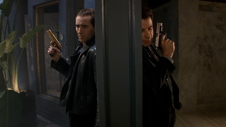 John Travolta as Sean Archer and Nicolas Cage as Castor Troy in Face/Off