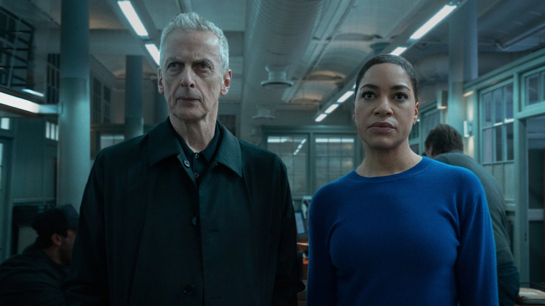Daniel Hegarty and June Lenker looking serious and standing in a hallway on Criminal Record