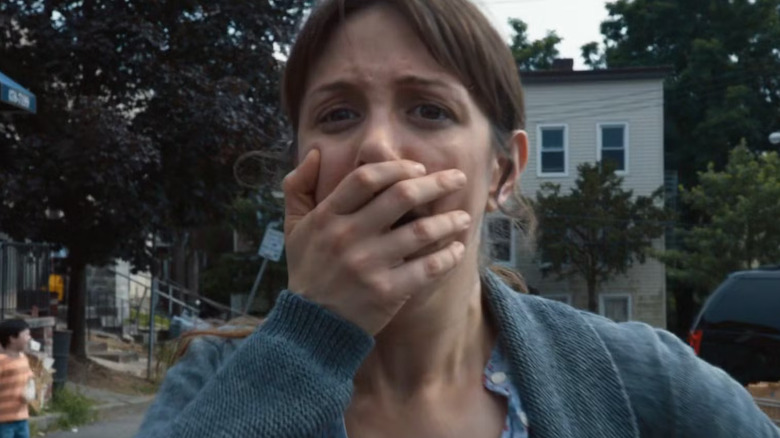 A woman in shock puts her hand on her mouth in "The Leftovers" (2014-2017)