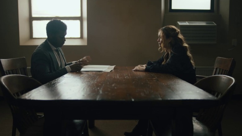 Casi and Lea sit at a table and talk
