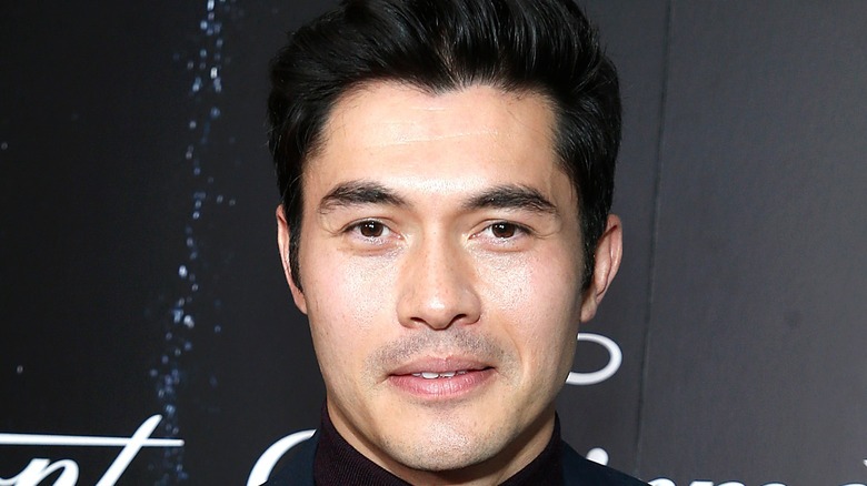 Henry Golding attends event 