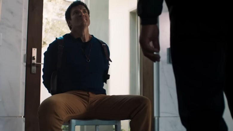 Goon looming over Nathan Drake tied to chair in Uncharted fan film (2018)