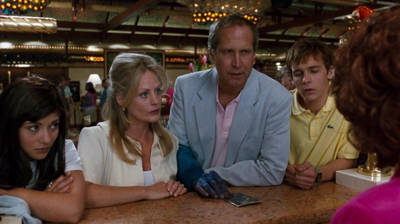 The Griswold family at hotel counter in "National Lampoon's Vegas Vacation"