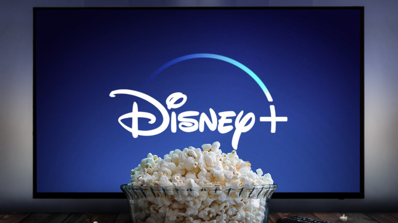 Disney+ logo on TV screen and popcorn