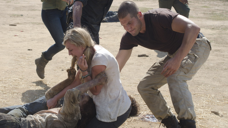 Shane pulling Beth away from walker