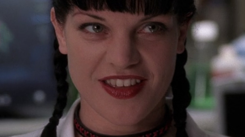 Abby Sciuto smiling in her lab