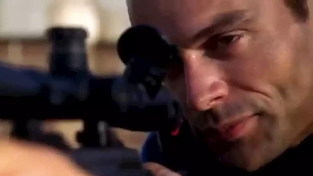 Ari Haswari with rifle