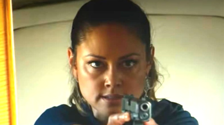 Vanessa Lachey holding a gun