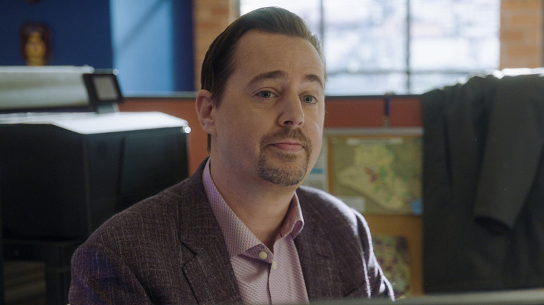Timothy McGee smiling slightly