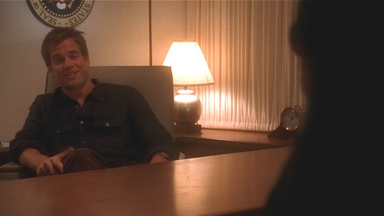 Tony smiles and sits as the President's desk