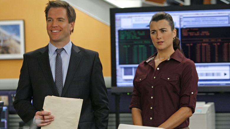 Tony standing next to Ziva