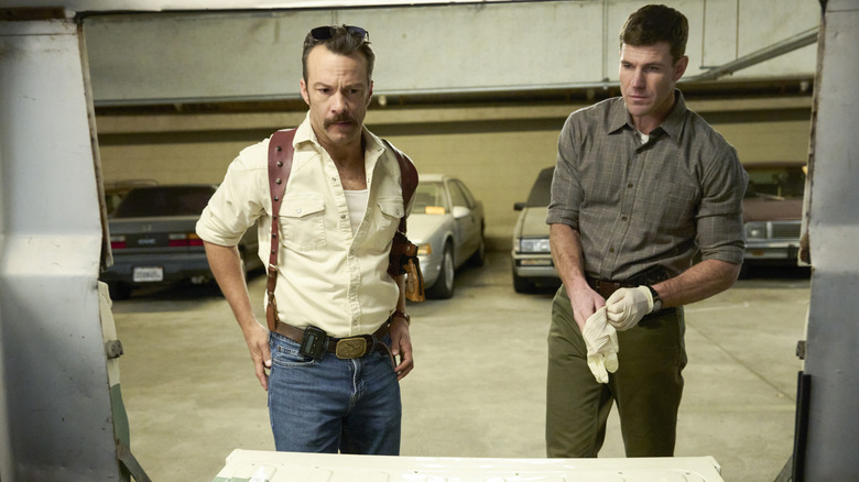 Gibbs and Franks prepare to examine some evidence in 