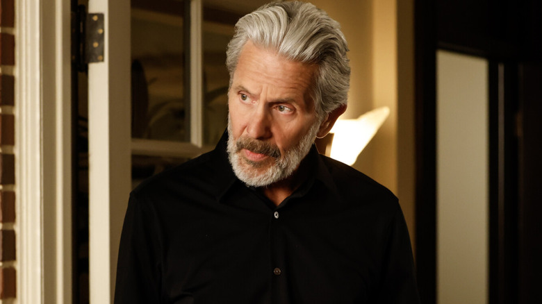 Alden Parker holds a coffee cup in 