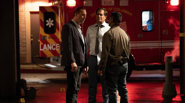 Timothy McGee, Tony DiNozzo, and Nicholas Torres standing by ambulance in NCIS (2026)