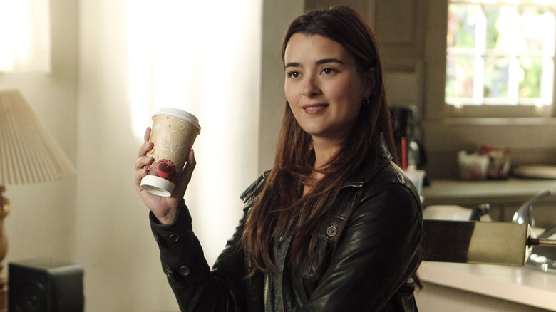 Ziva holding coffee